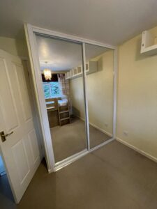 Boiler cupboard changed into sliding door wardrobe after