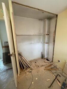 Boiler cupboard changed into sliding door wardrobe before